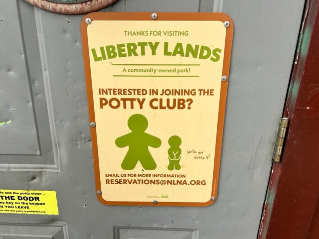 A sign about the The Liberty Lands Potty Club in front of the locked restroom. Not open to the public. E-mail for a "reservation".