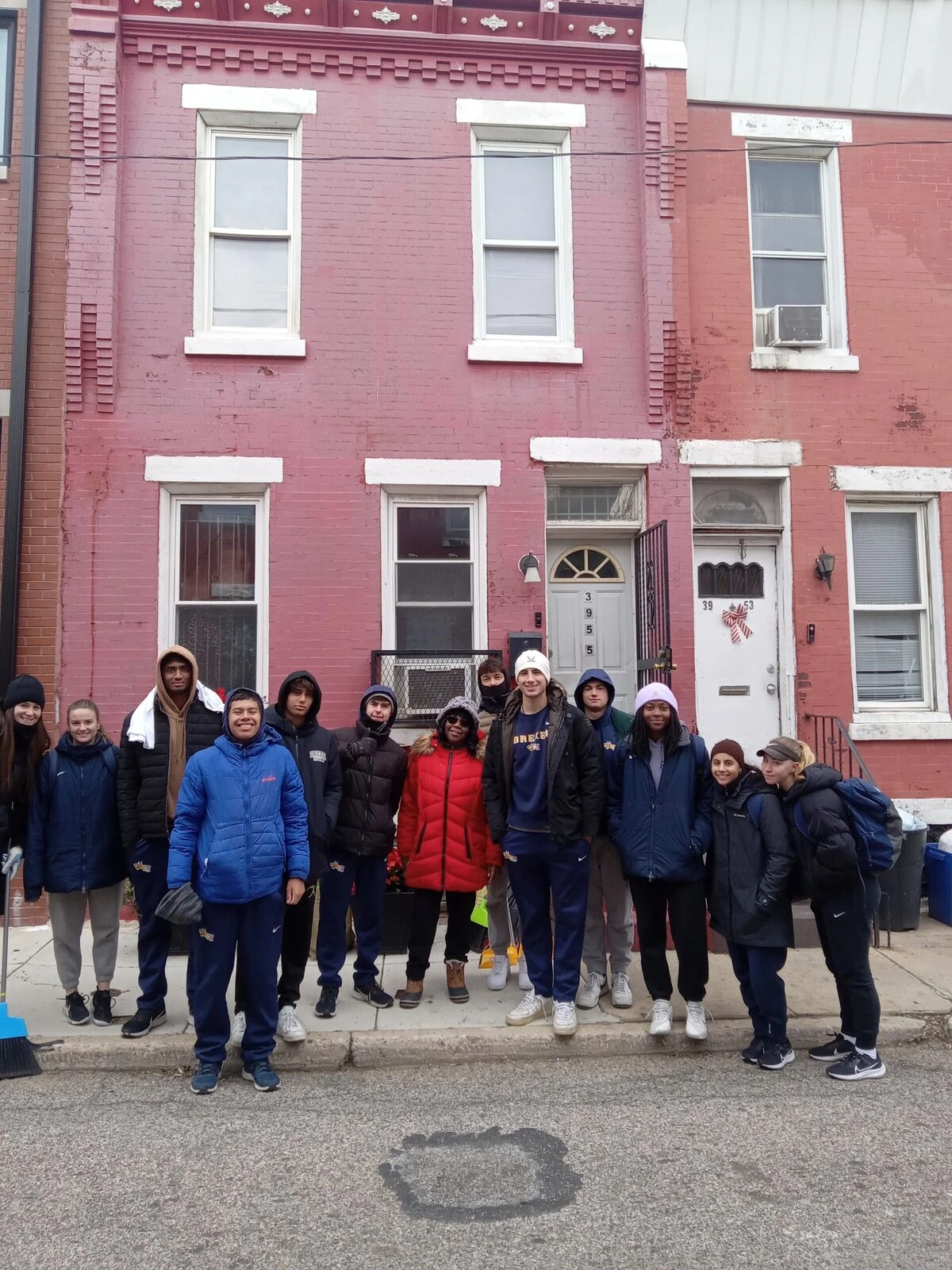 Linda Lloyd (in the red coat) with UPenn students on Martin Luther King Jr. holiday cleanup. 
