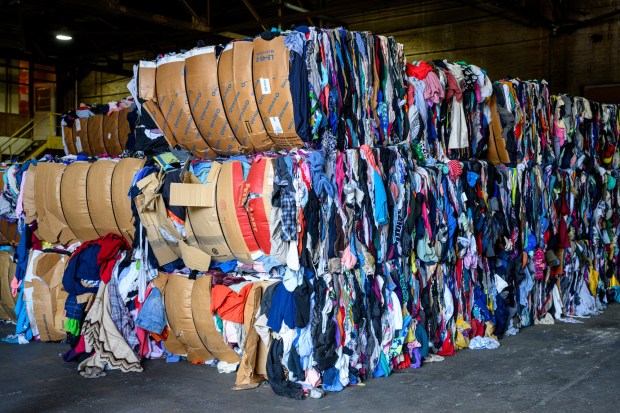 Unsold textiles at Opportunity House's OppShop warehouse in Reading are bundled for recycling. (Courtesy of Opportunity House)