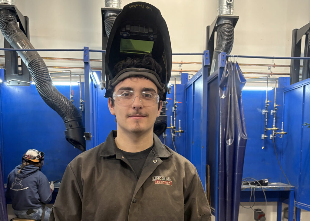 student wearing welding gear