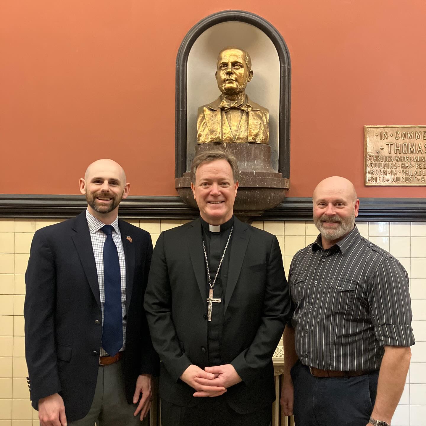 Bishop Keith Chylinski poses with Roman President John Prendergast, left,...