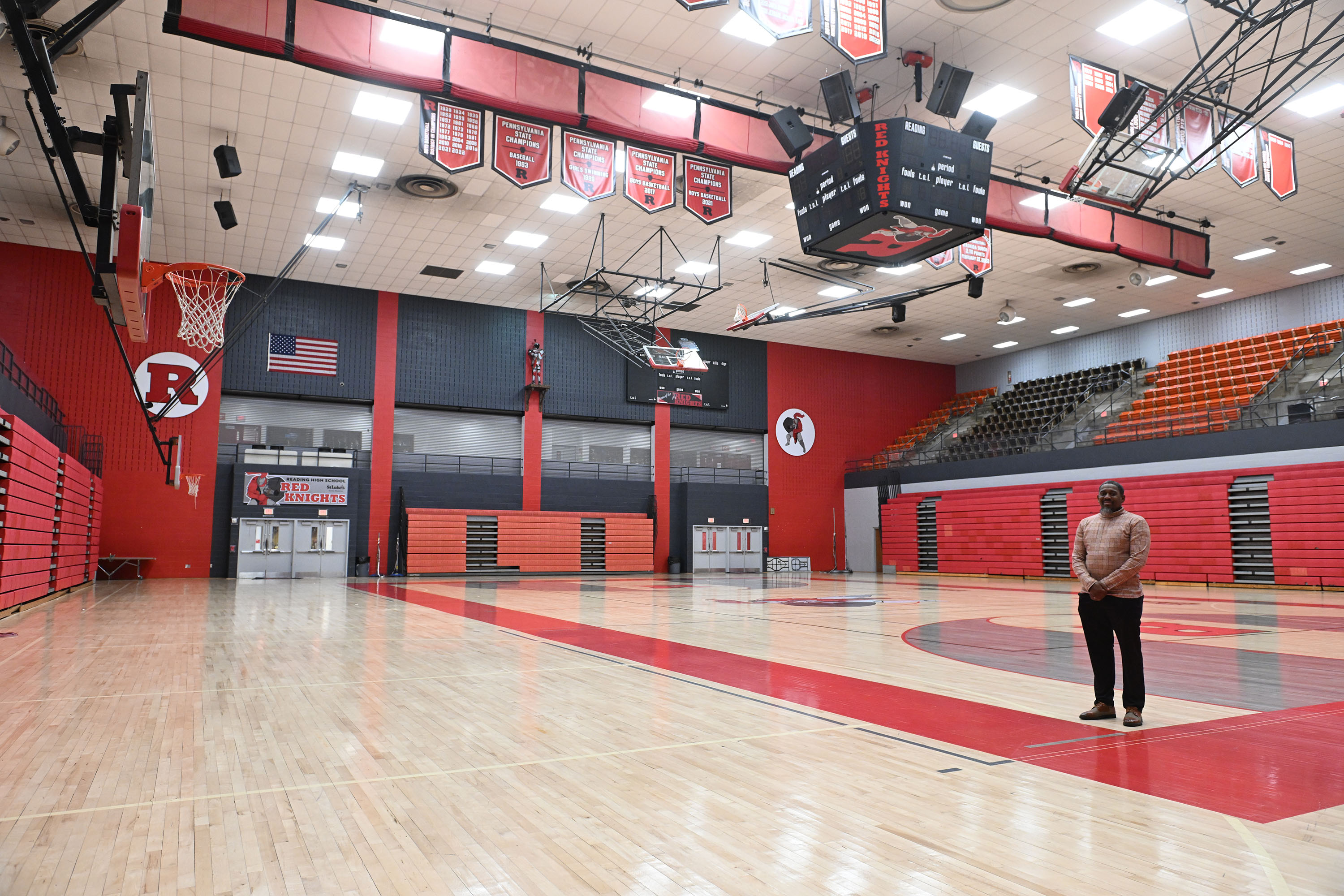 Reading High Athletic Director J Greene stands on the basketball...