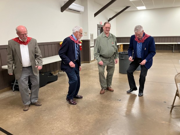 Keith Brintzenhoff, Richard Miller, David Adam and Paul Adam kicked up their heels and danced to the lively music by the Shooflies band during the 85th Pennsylvania German Gathering of Berks County held April 6 at Leesport Farmer's Market Banquet Hall. (Photo courtesy of Mary Laub)