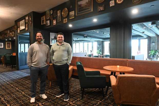 Owner Chuck Gulati, left, and general manager Mark Rose stand in the gallery of Jack's On the Green. The Reading Country Club will be celebrating a first anniversary open house on April 11. (BILL UHRICH/MEDIANEWS GROUP)