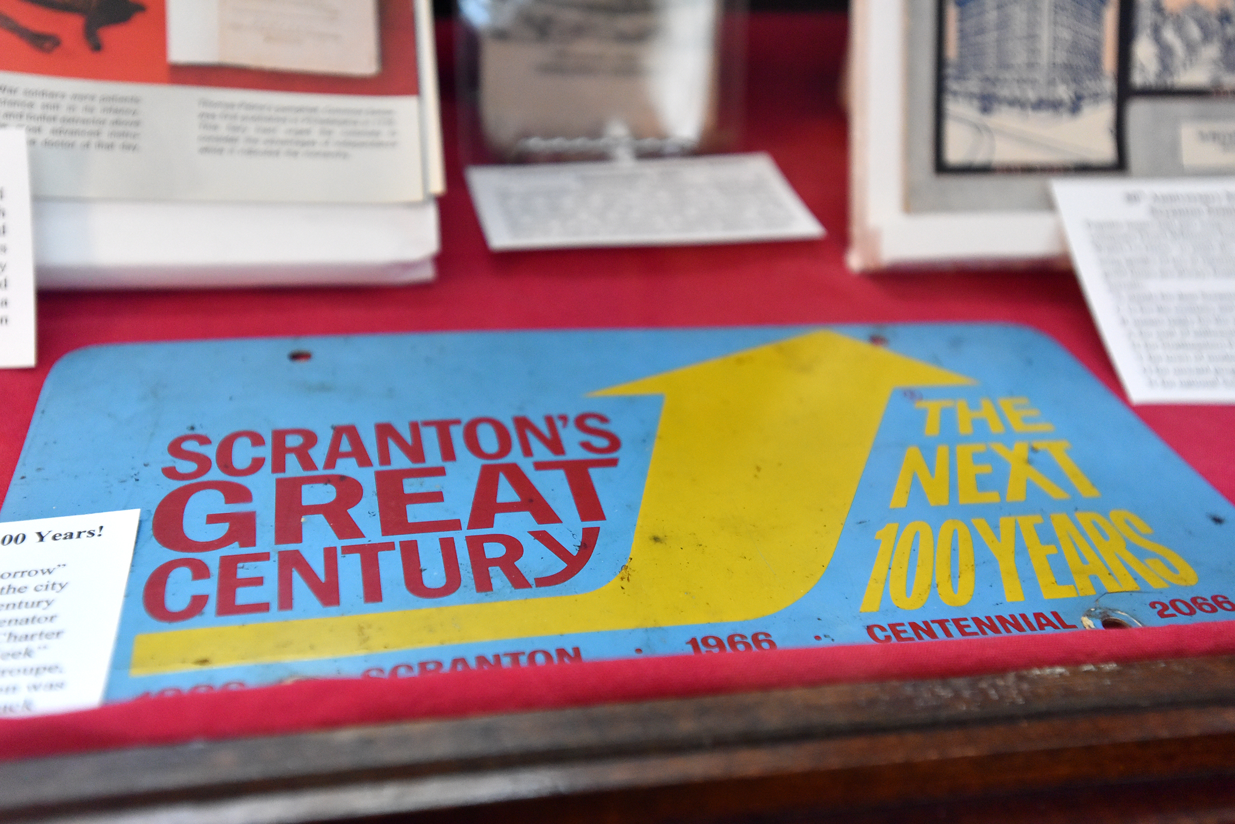 An item that celebrates Scranton’s centennial from 1966 sits in...