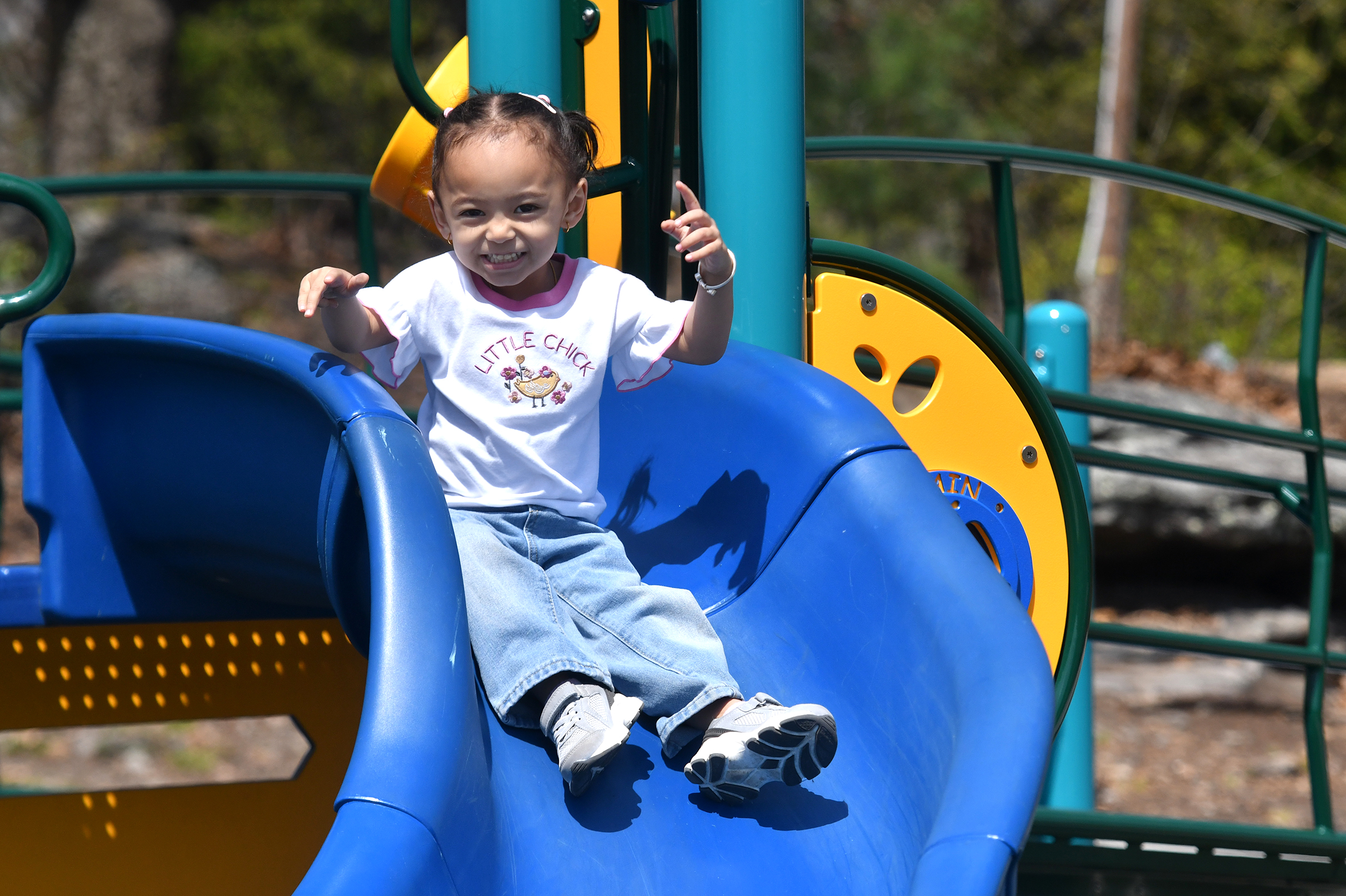 Eliana Pariyar, 4, of Cincinnati, Oh., enjoys the slide in...