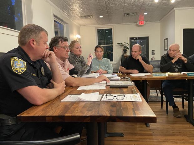 Dalton Borough Secretary Laura Kinney, center, speaks during the Sept. 21, 2023 Dalton Borough Council meeting about the process of getting reimbursed for flooding that hit the borough Sept. 9, 2023. (TIMES-TRIBUNE / FILE PHOTO)