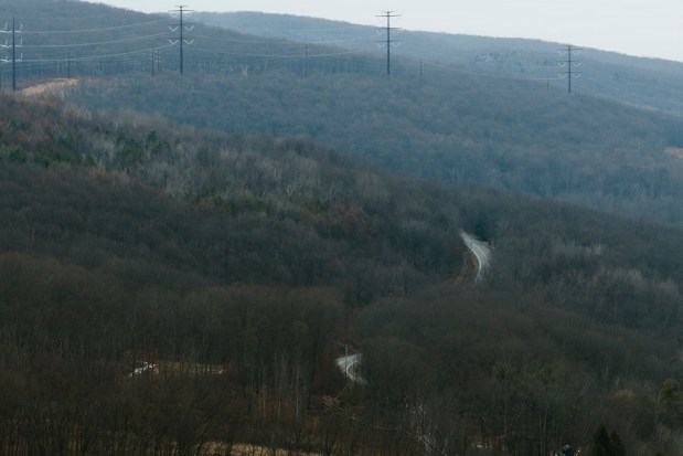 Wildcat Road winds up the mountain looking north towards a section of power lines in the Eynon section of Archbald Friday, January 9, 2026. (SEAN MCKEAG / STAFF PHOTOGRAPHER)