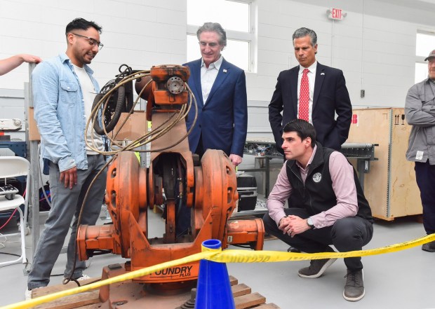Lackawanna College Robotics and Automation student Karim Vasquero, far left, talks with U.S. Secretary of the Interior Doug Burgum, U.S. Rep. Dan Meuser and U.S. Rep. Rob Bresnahan in the ABB Robotics training facility in Scranton Monday, April 13, 2026. (SEAN MCKEAG / STAFF PHOTOGRAPHER)