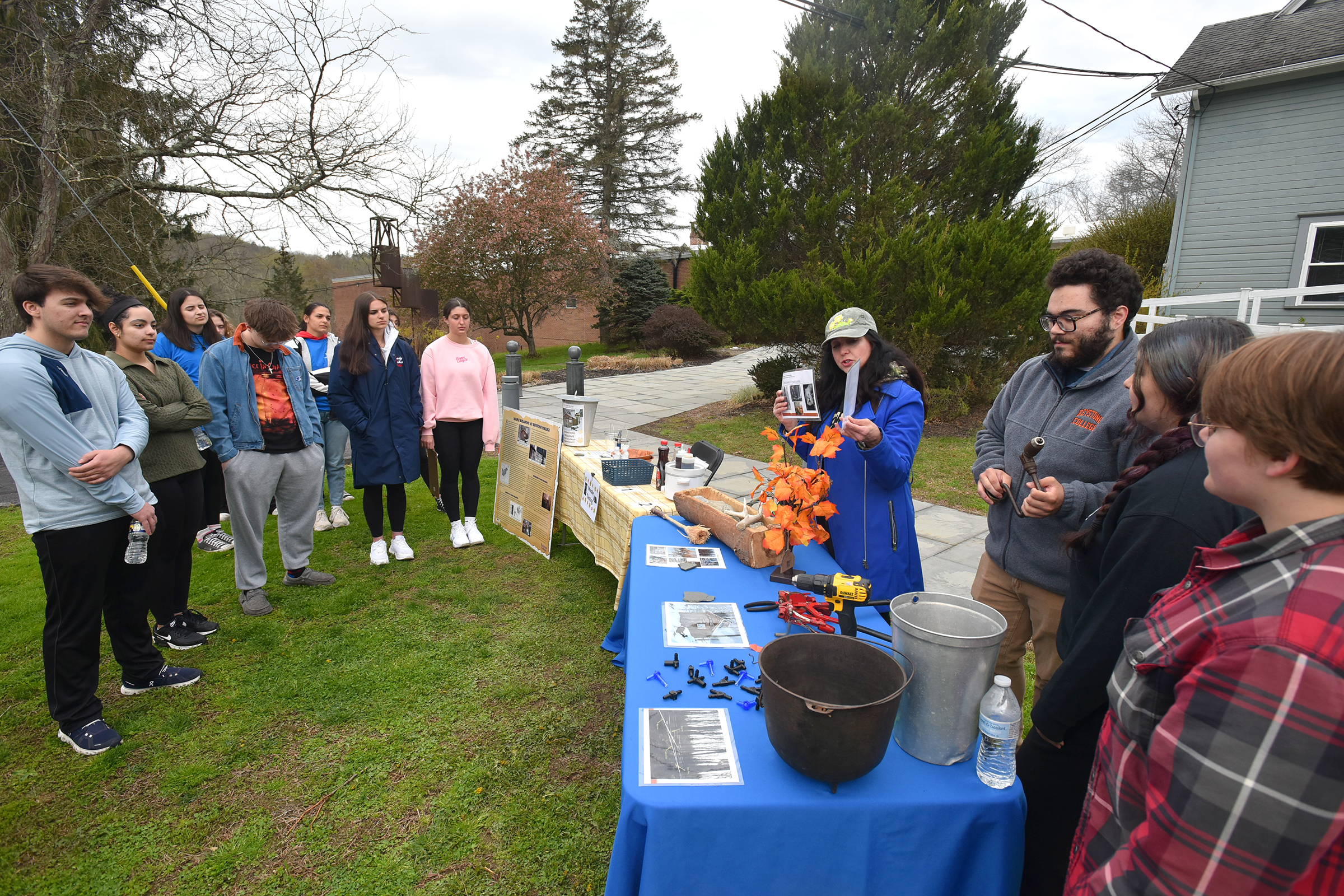Area high school students learn about making maple syrup from...