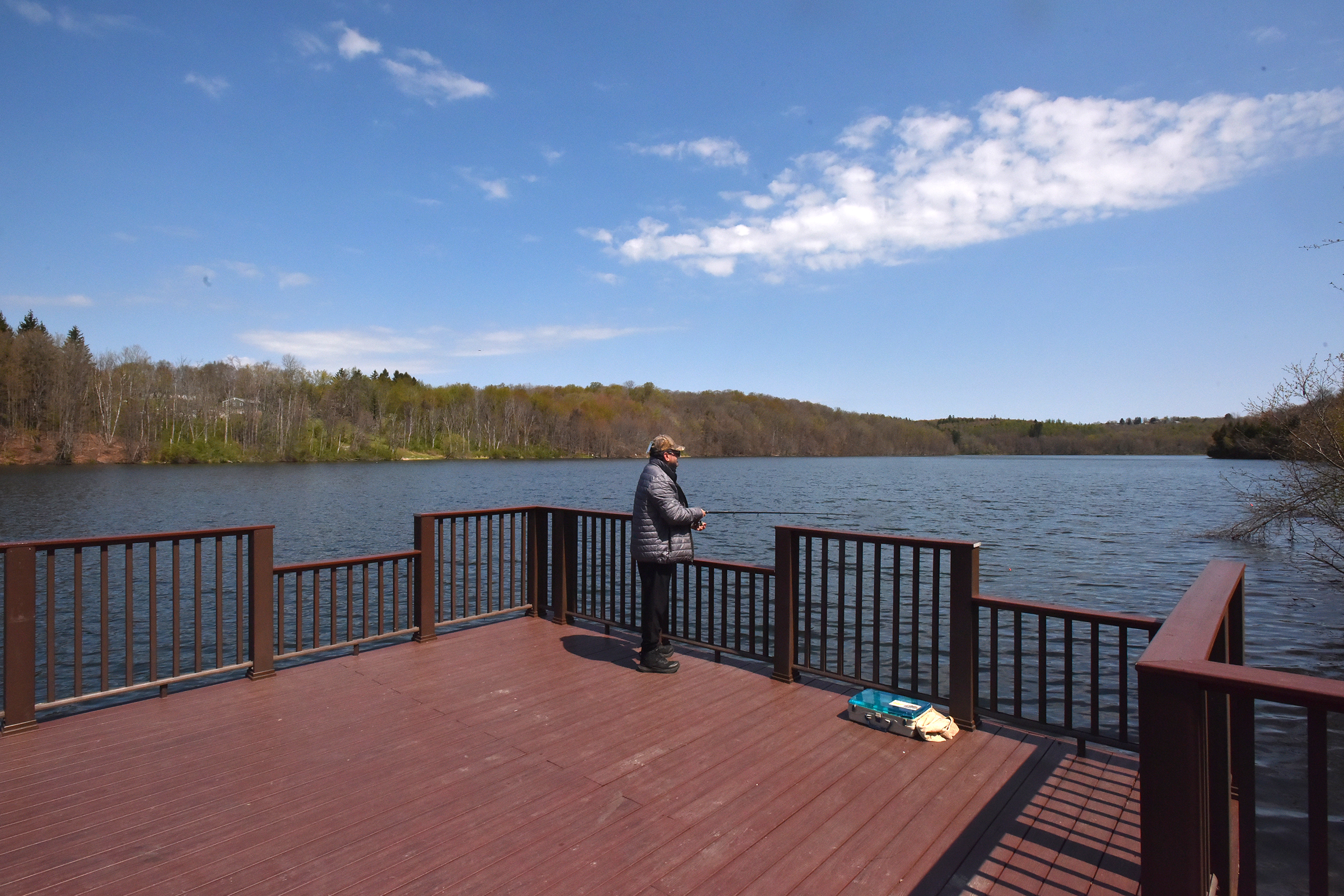 Simon German, of Staten Island, New York, fishes off of...