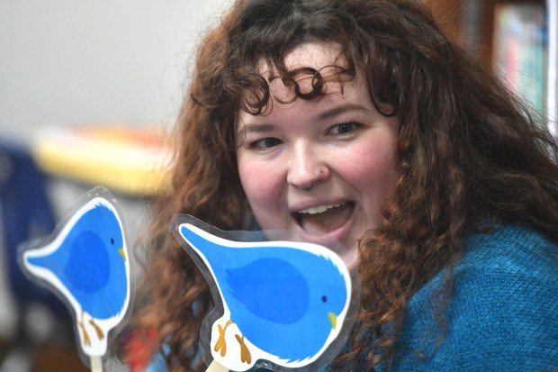 Children's Program Coordinator Maggie Maloney sings a song for children during the Toddlers on the Move event held to celebrate National Library Week at the Nancy Kay Holmes Branch Library in Scranton Monday, April 20, 2026. (SEAN MCKEAG / STAFF PHOTOGRAPHER)