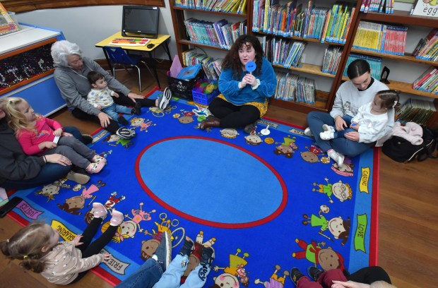 Children's Program Coordinator Maggie Maloney leads an activity during the Toddlers on the Move event held to celebrate National Library Week at the Nancy Kay Holmes Branch Library in Scranton Monday, April 20, 2026. (SEAN MCKEAG / STAFF PHOTOGRAPHER)