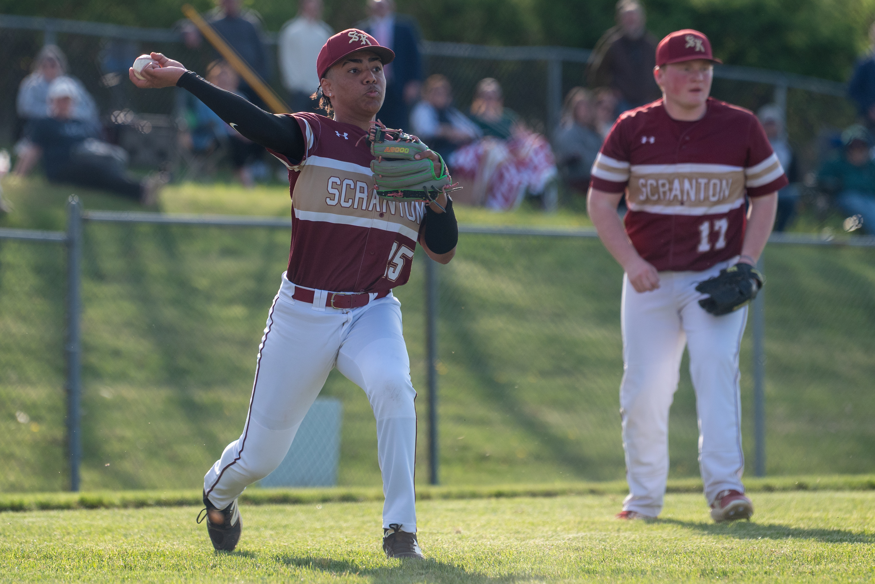 Scranton third baseman Erick Guerrero throws the ball to first...