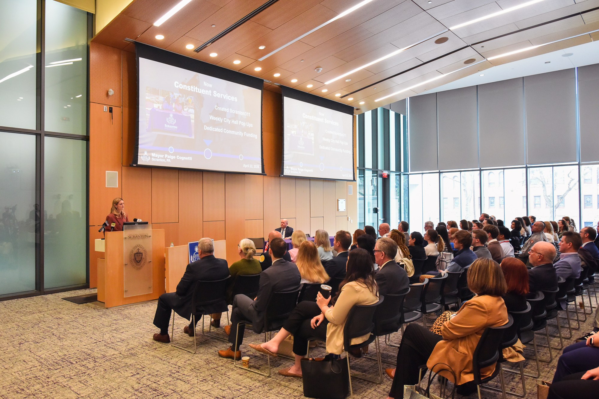 Guests listen as Scranton Mayor Paige Gebhardt Cognetti gives the State of the City Address in the Kane Forum at University of Scranton's Leahy Hall in Scranton Wednesday, April 22, 2026. (SEAN MCKEAG / STAFF PHOTOGRAPHER)