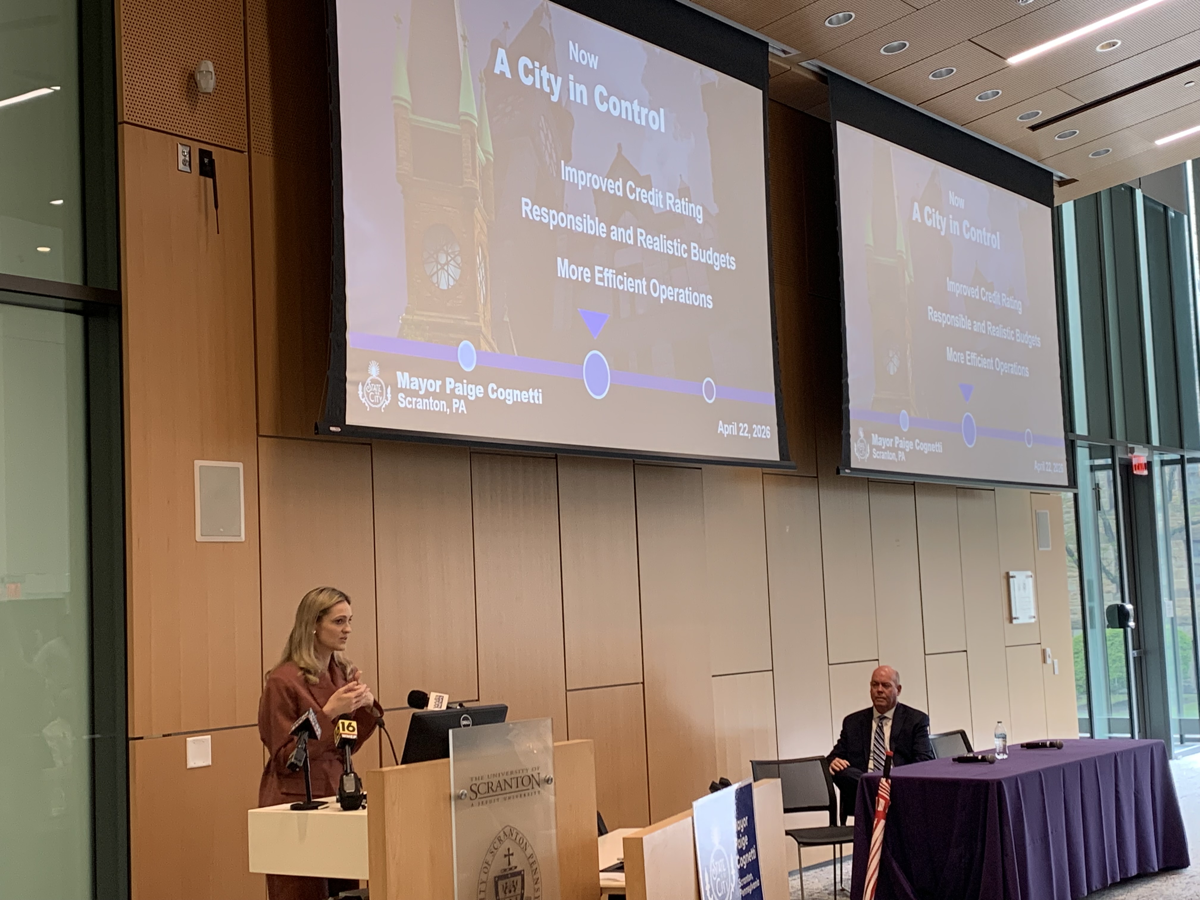 Scranton Mayor Paige Gebhardt Cognetti, at podium at left, delivers...