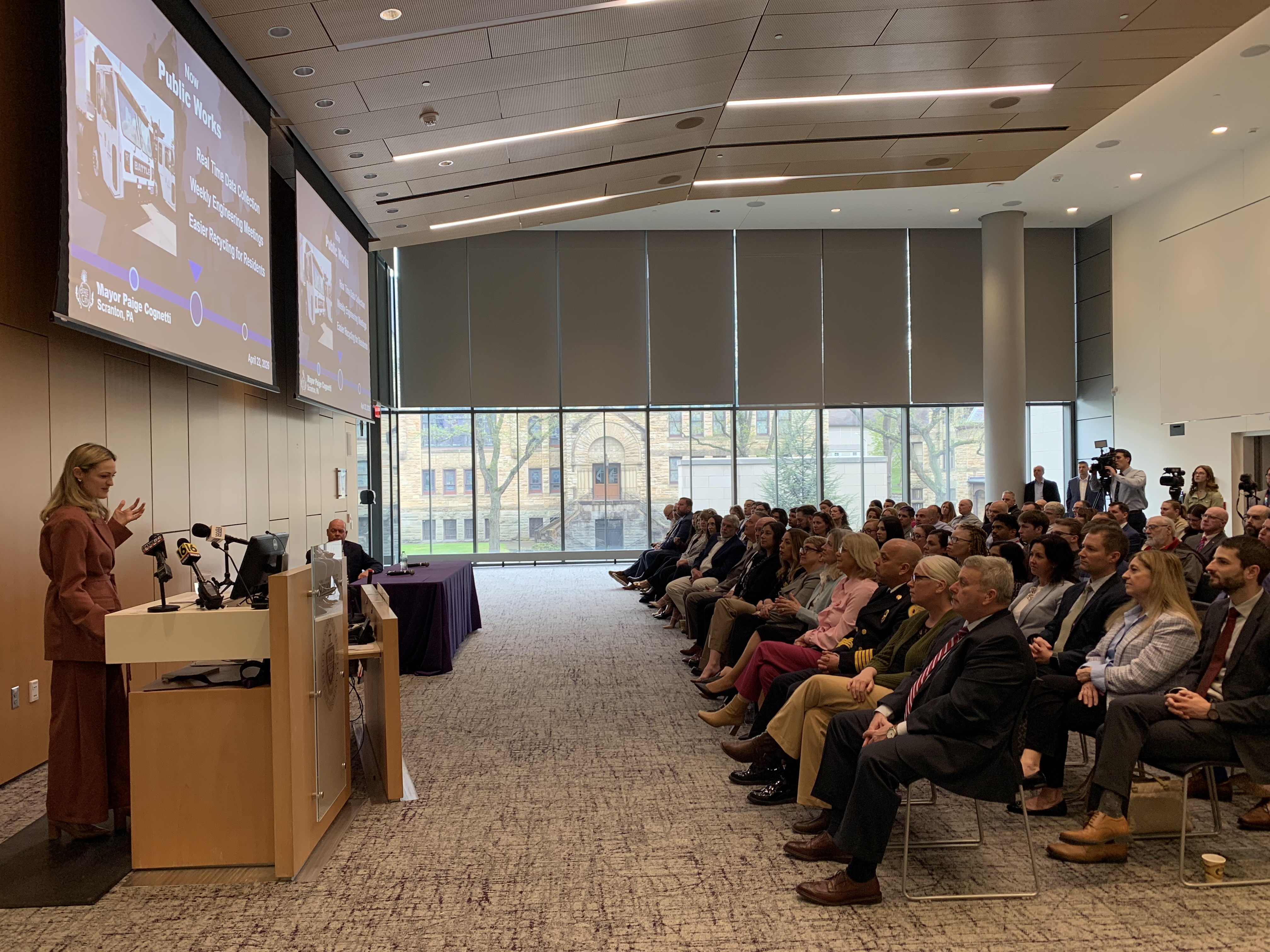 Scranton Mayor Paige Gebhardt Cognetti, at podium at left, delivers...