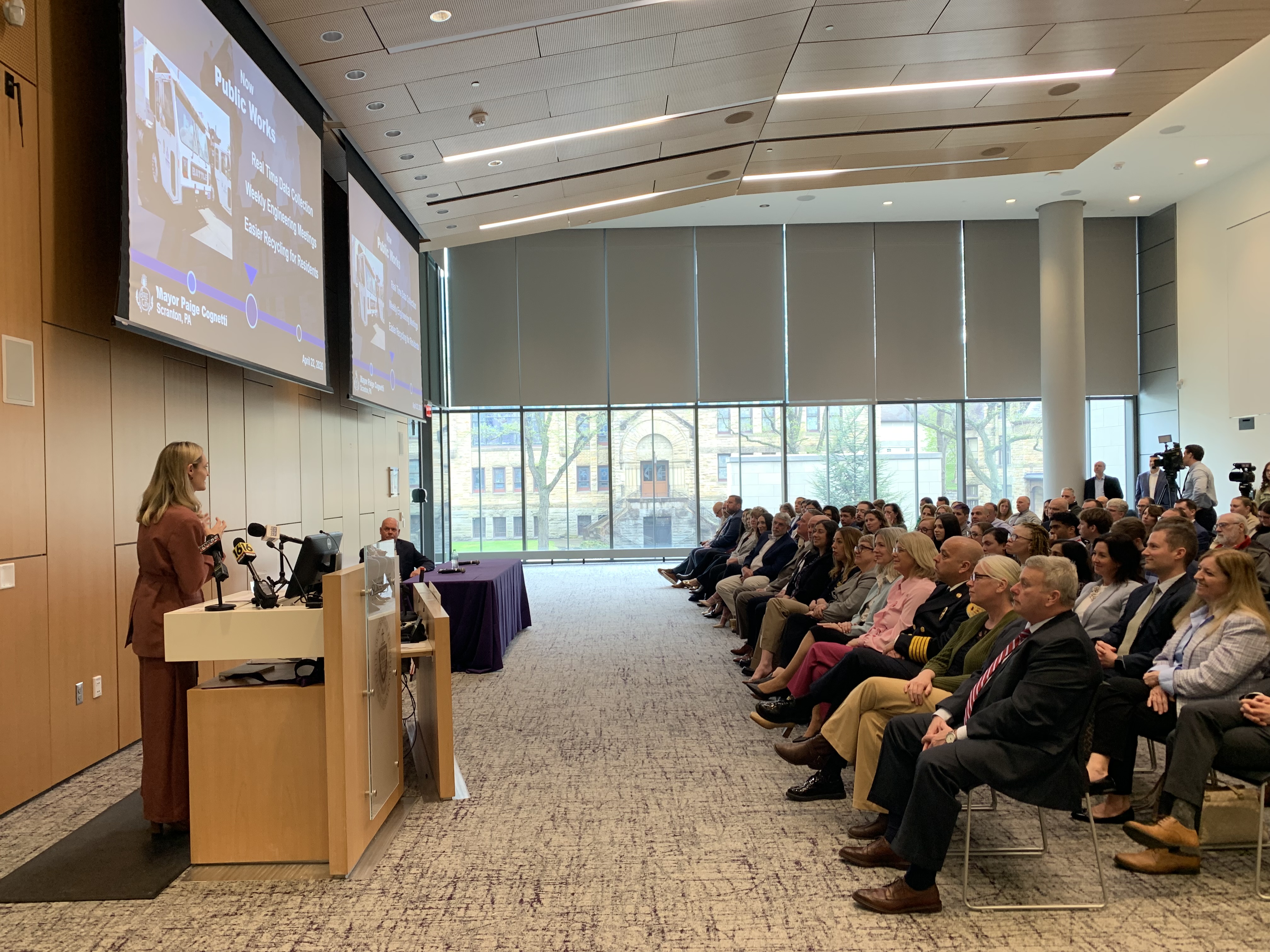 Scranton Mayor Paige Gebhardt Cognetti, at podium at left, delivers...