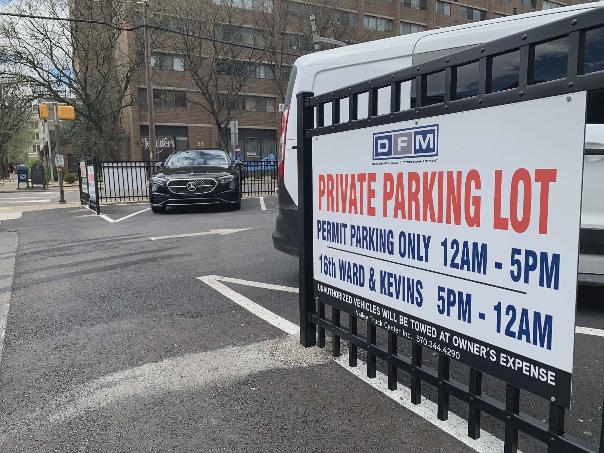 A parking lot is located at the intersection of Penn...