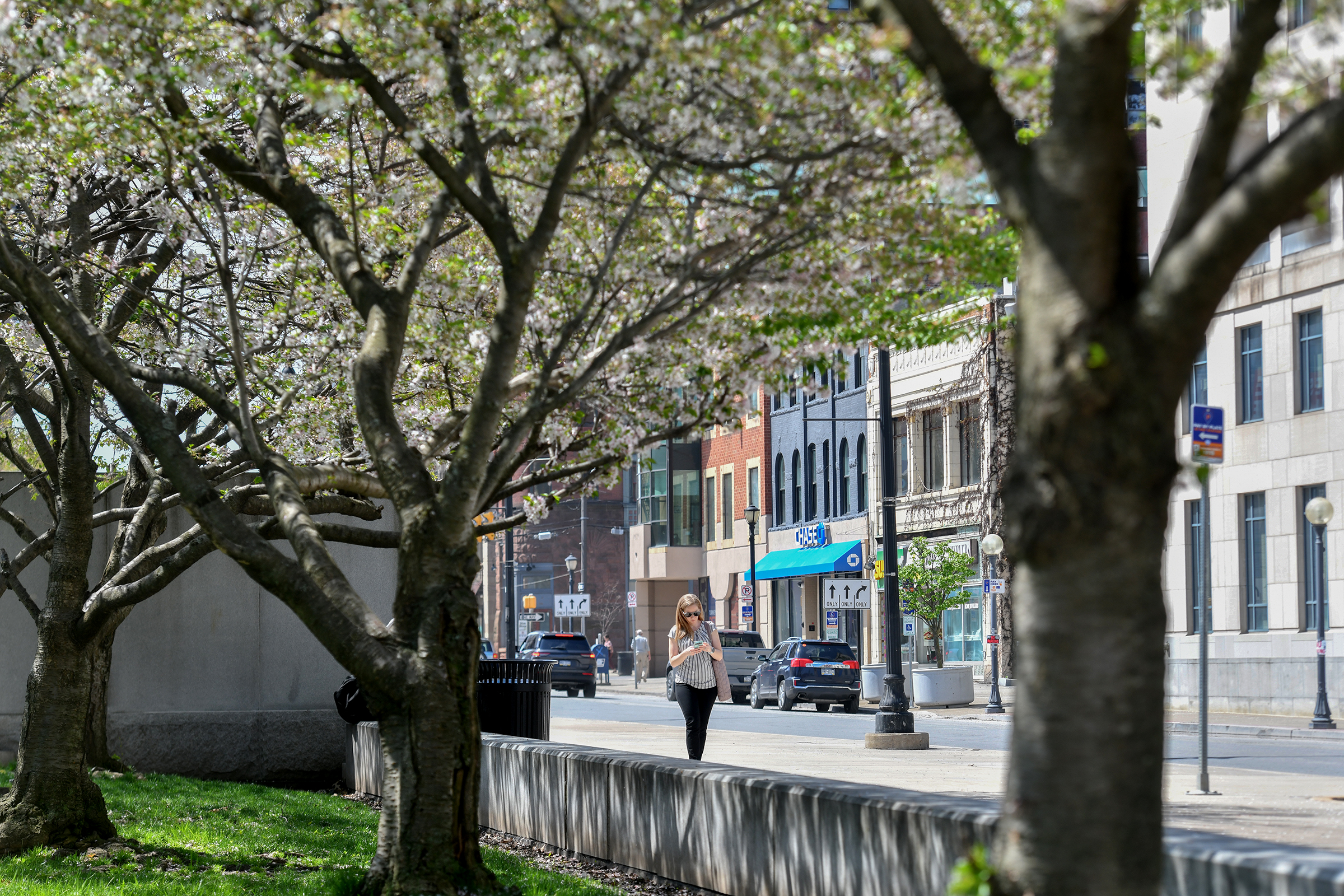 A woman walks on North Washington Avenue in downtown Scranton...