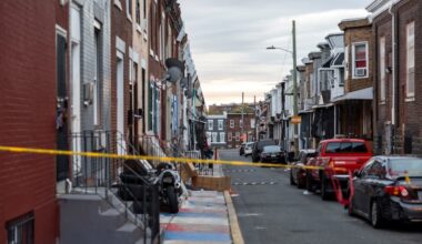 Philadelphia police officers stationed a vehicle at the location where federal agents raided Kensington’s Weymouth Street and arrested more than 30 alleged members of a drug ring last year.