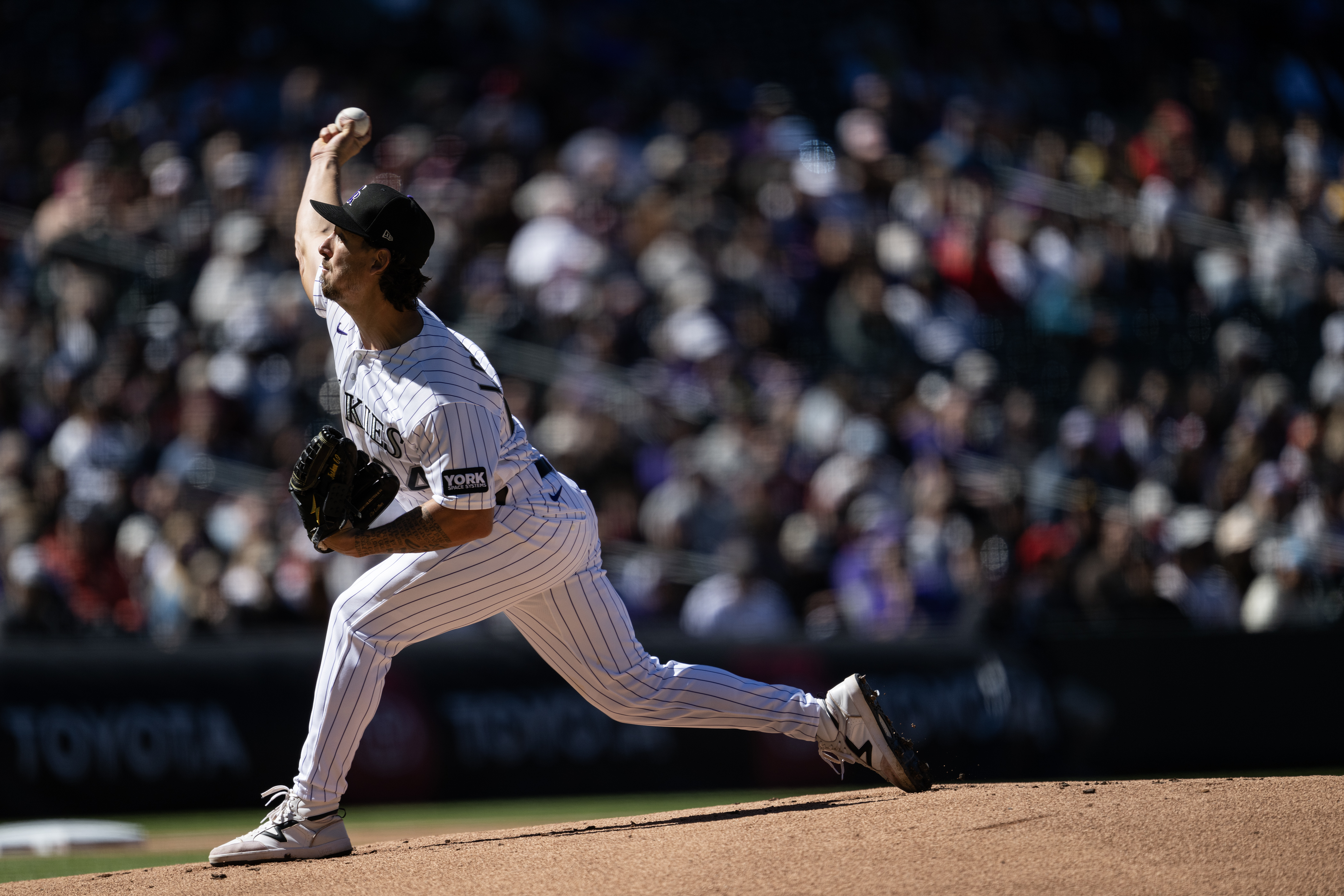 Pitcher Michael Lorenzen (24) of the Colorado Rockies pitches in...
