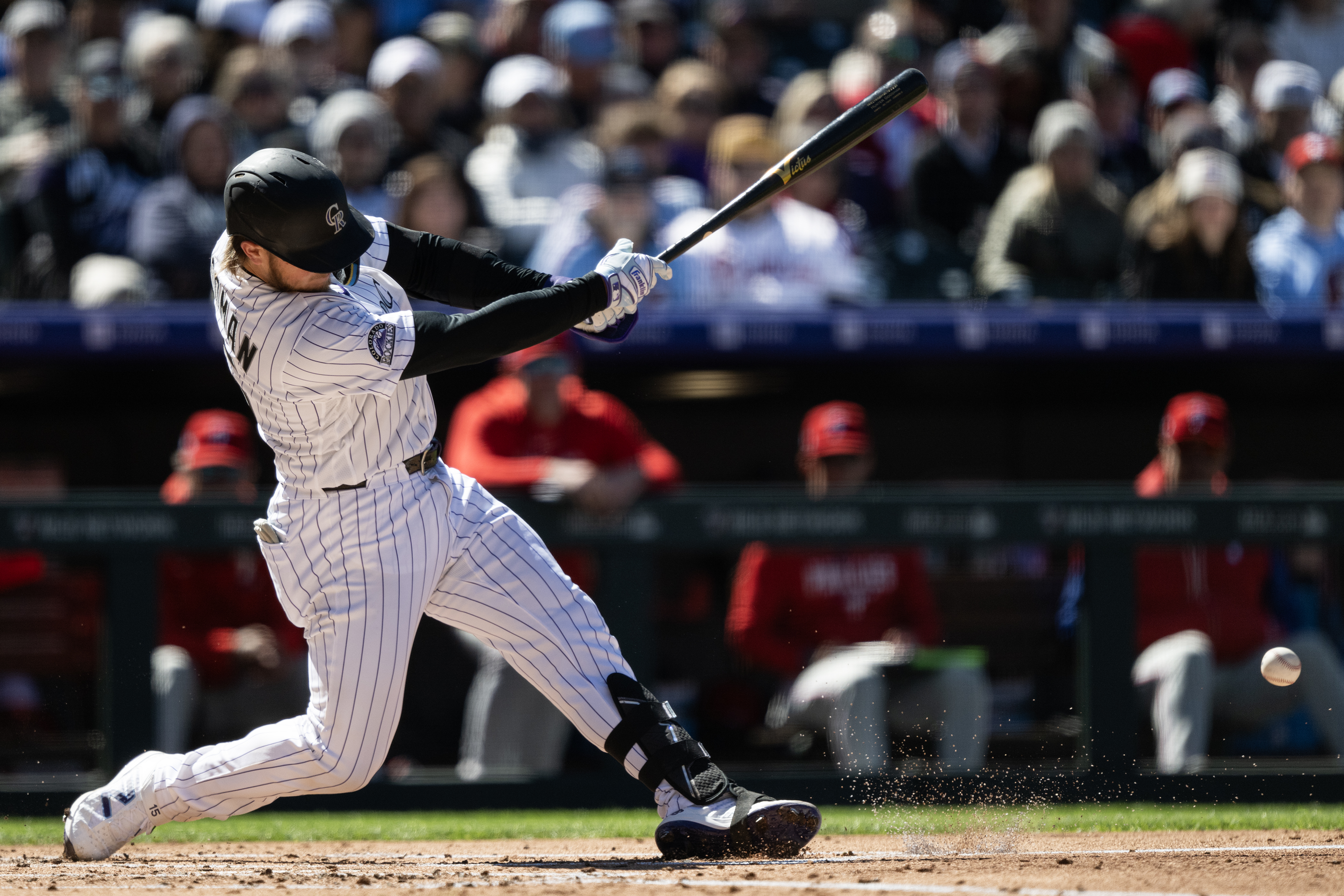 Catcher Hunter Goodman (15) of the Colorado Rockies fouls one...