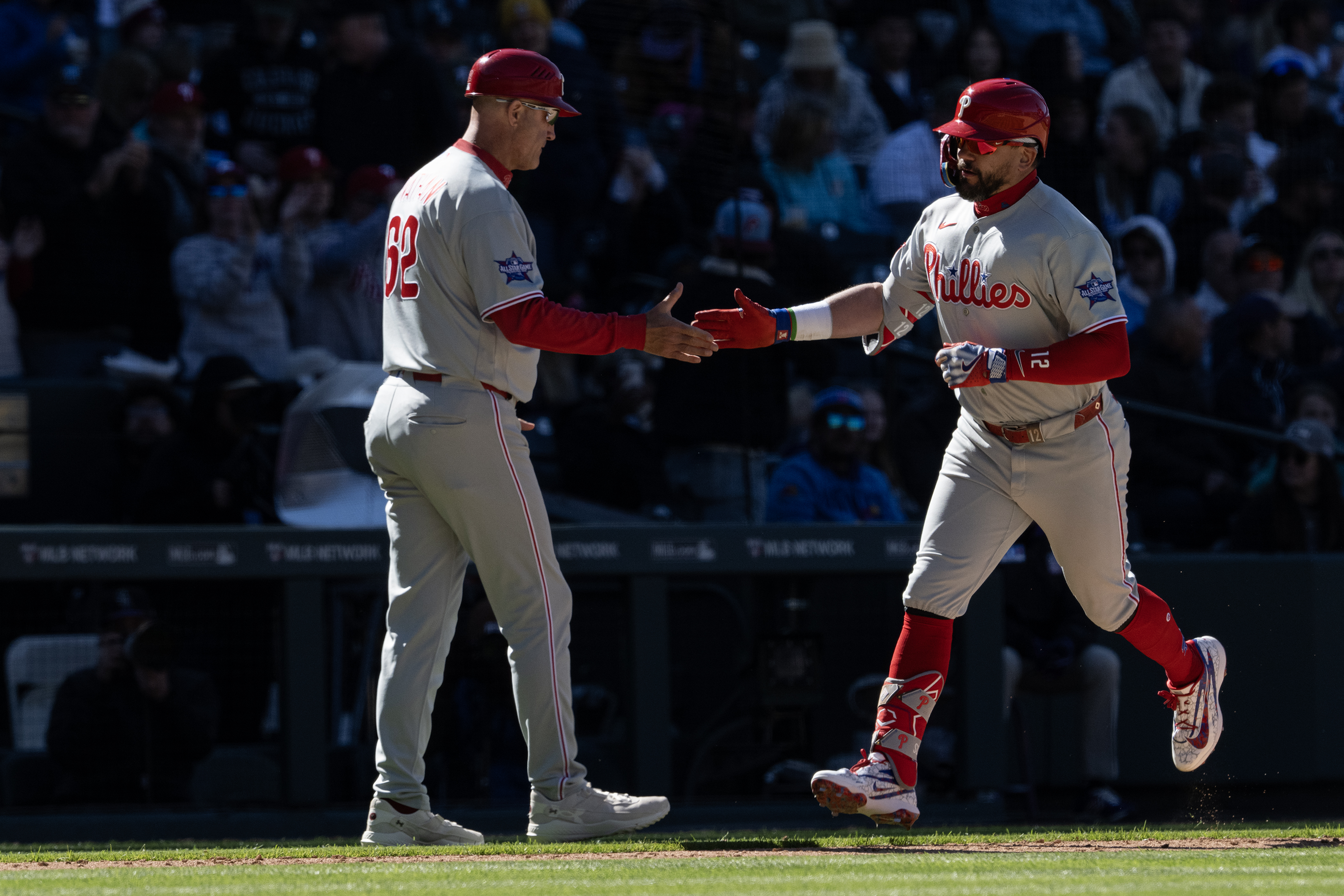 Left fielder Kyle Schwarber (12) of the Philadelphia Phillies is...