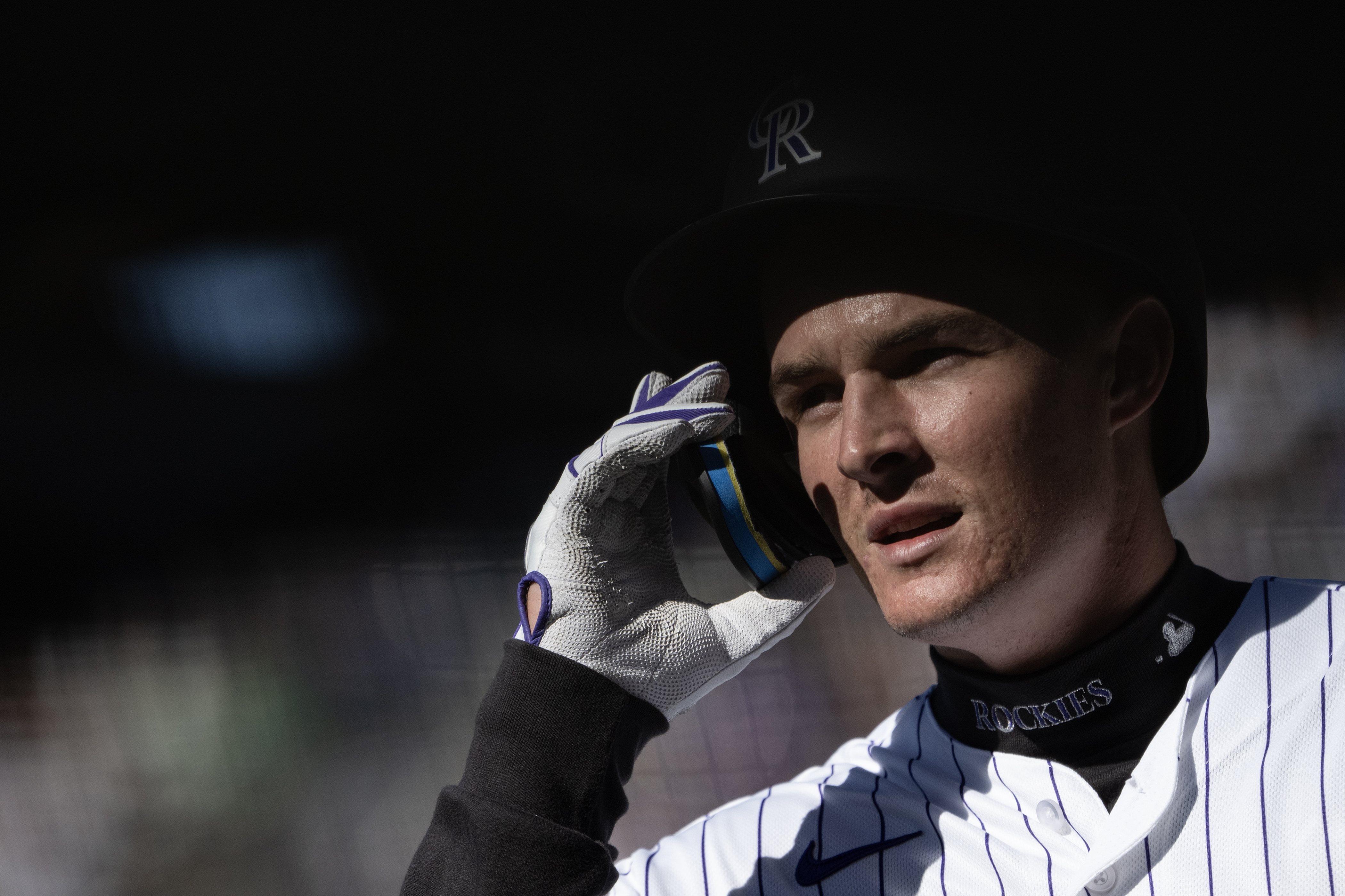 Mickey Moniak (22) of the Colorado Rockies walks to the...