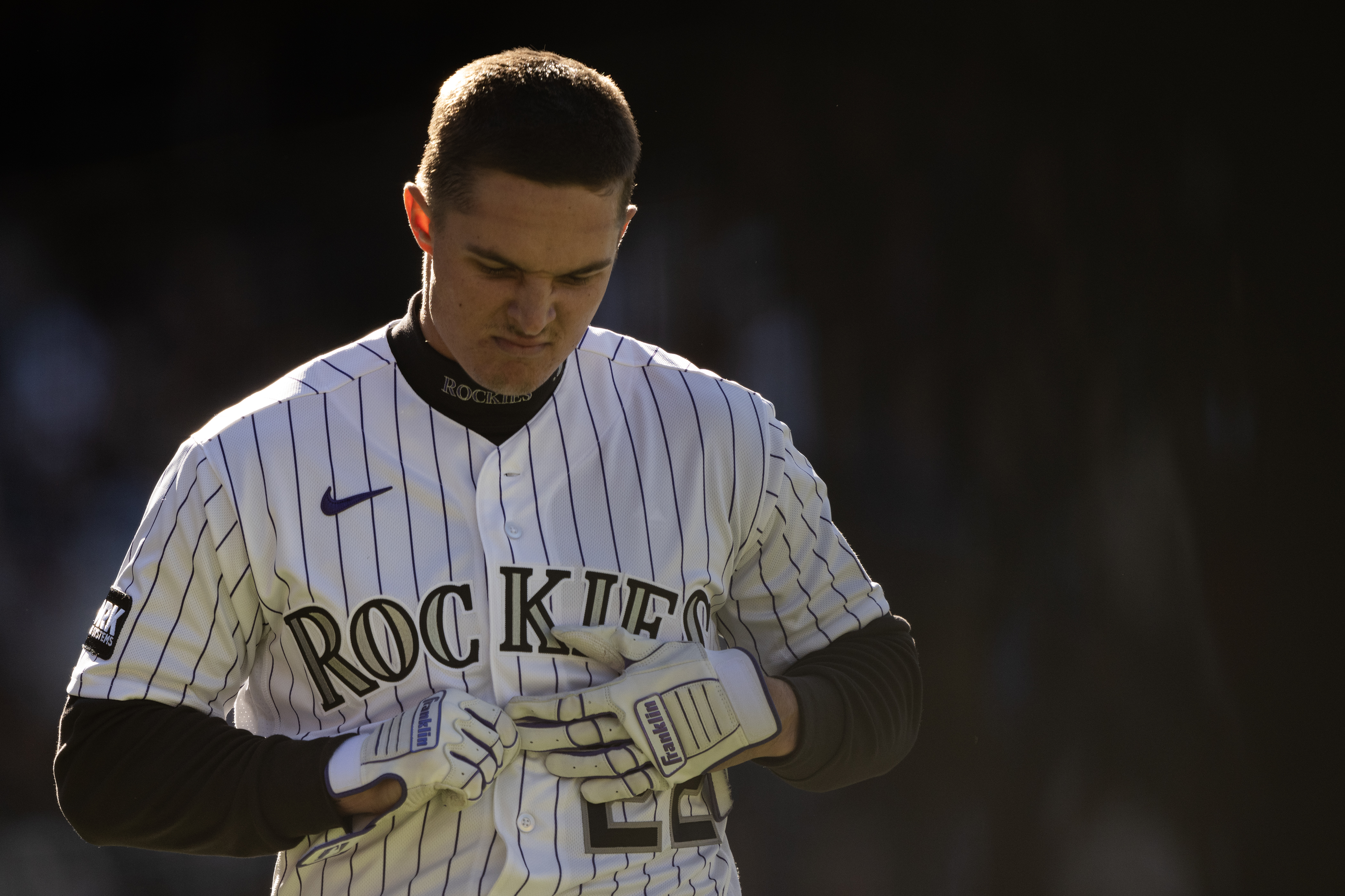 Right fielder Mickey Moniak (22) of the Colorado Rockies reacts...