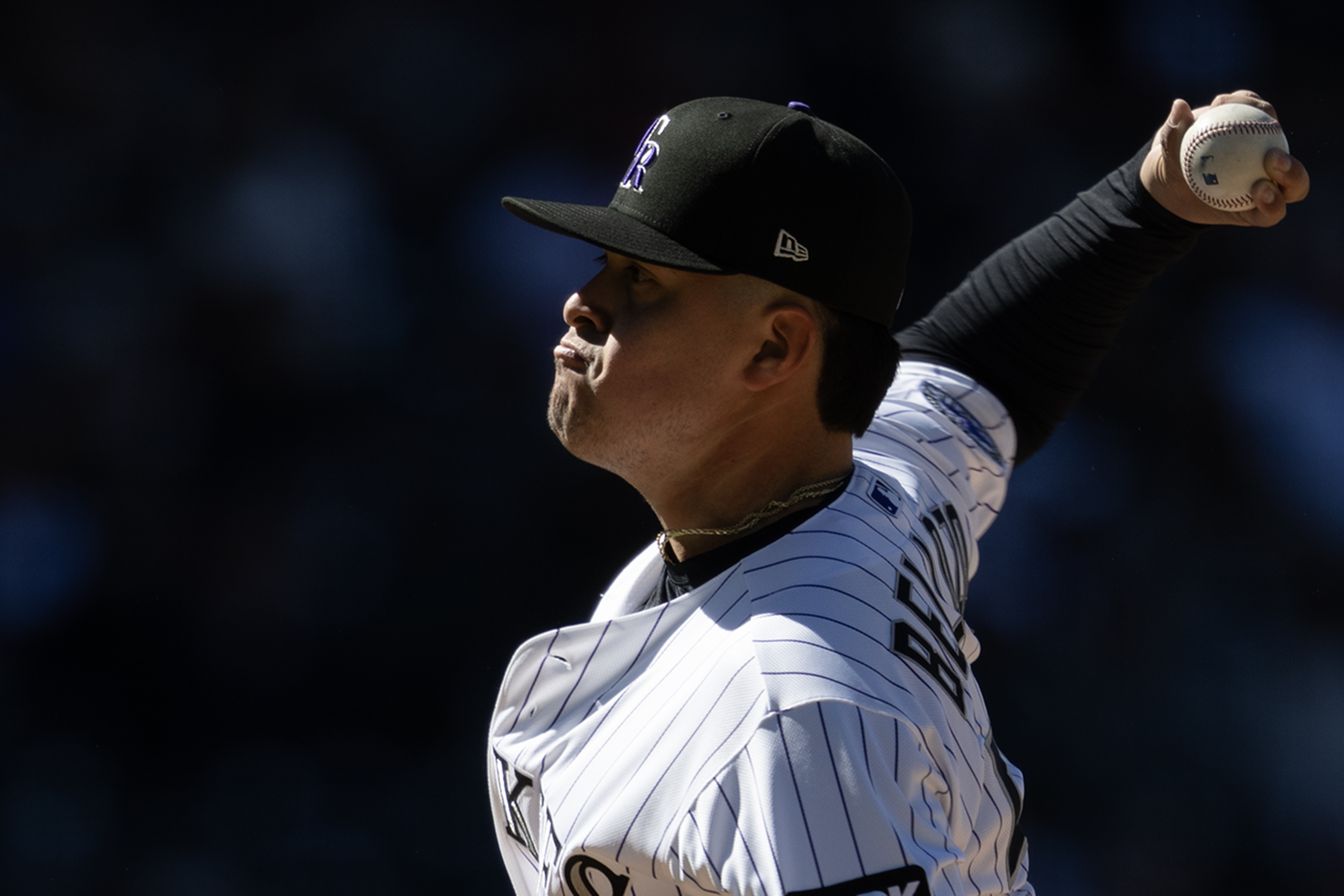 Pitcher Valente Bellozo (56) of the Colorado Rockies throws during...