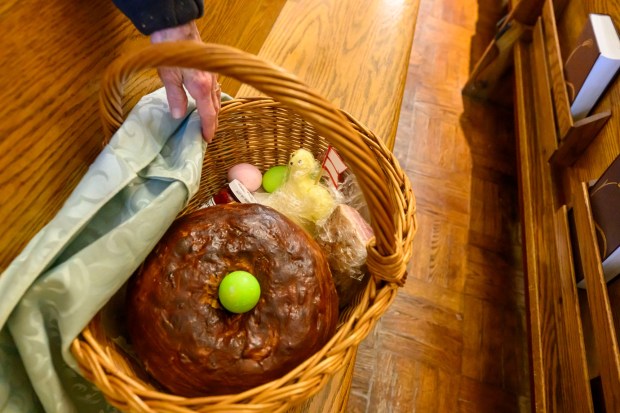 Mary Stofanak Rzucidlo, 92, of Bethlehem shows her Easter basket filled with food Saturday, April 4, 2026, to be blessed by Rev. Giuseppe Esposito on Holy Saturday at St. Anne Catholic Church in Bethlehem. Stofanak Rzucidlo has been getting her Easter baskets blessed since she was 8 years old. (April Gamiz/The Morning Call)