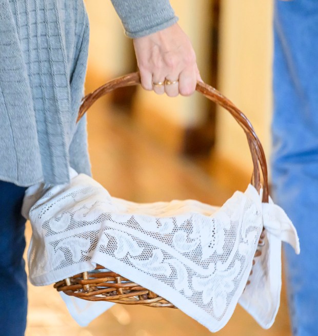 Catholics carry baskets filled with Easter foods to be blessed Saturday, April 4, 2026, during a blessing of the food baskets on Holy Saturday at St. Anne Catholic Church in Bethlehem. (April Gamiz/The Morning Call)