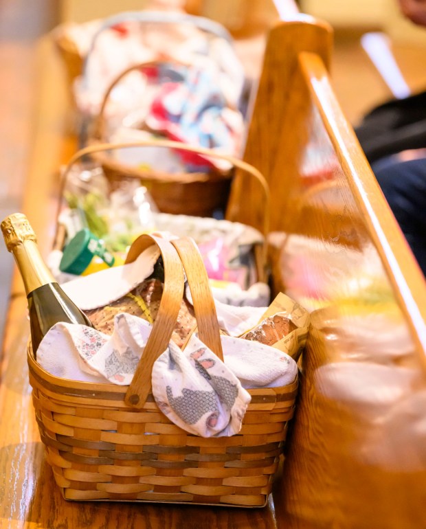 Catholics bring baskets filled with Easter foods to be blessed Saturday, April 4, 2026, during a blessing of the food baskets on Holy Saturday at St. Anne Catholic Church in Bethlehem. (April Gamiz/The Morning Call)