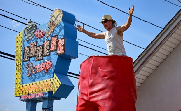 Roadside artist Mark Cline prepares the bottom half of the Giant Chip statue Thursday, April 16, 2026, at Inside Scoop in Coopersburg. The popular, 25-foot-high statue was toppled by high winds in February. Cline, who built the statue, was on site Thursday to repair it. (Monica Cabrera / The Morning Call)