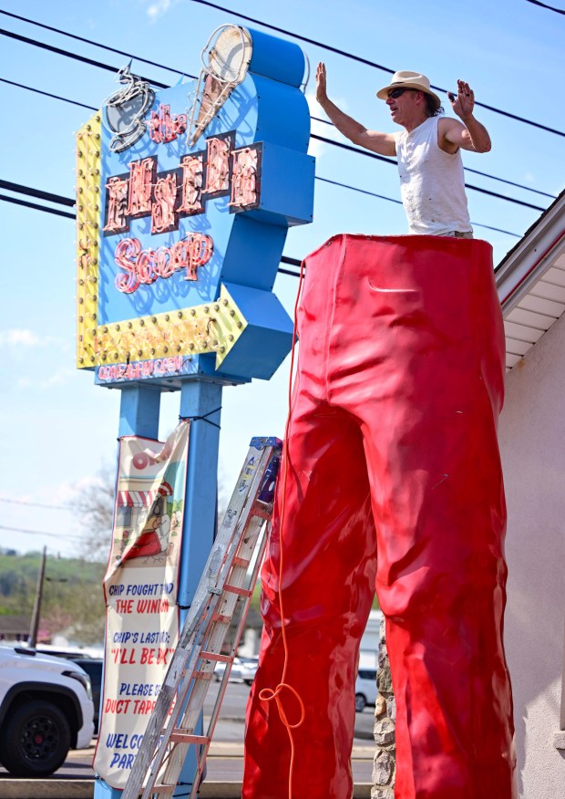 Roadside artist Mark Cline prepares the bottom half of the Giant Chip statue Thursday, April 16, 2026, at Inside Scoop in Coopersburg. The popular, 25-foot-high statue was toppled by high winds in February. Cline, who built the statue, was on site Thursday to repair it. (Monica Cabrera / The Morning Call)