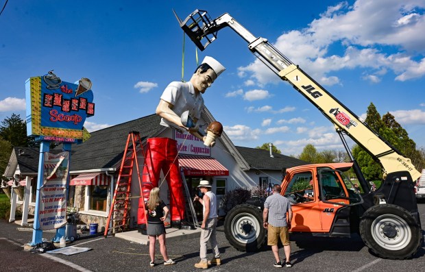 Roadside artist Mark Cline pieces the Giant Chip statue back together Thursday, April 16, 2026, at Inside Scoop in Coopersburg. The popular, 25-foot-high statue was toppled by high winds in February. Cline, who built the statue, was on site Thursday to repair it. (Monica Cabrera / The Morning Call)