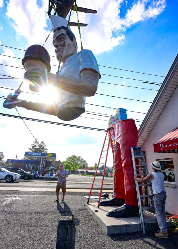 Roadside artist Mark Cline pieces the Giant Chip statue back together Thursday, April 16, 2026, at Inside Scoop in Coopersburg. The popular, 25-foot-high statue was toppled by high winds in February. Cline, who built the statue, was on site Thursday to repair it. (Monica Cabrera / The Morning Call)