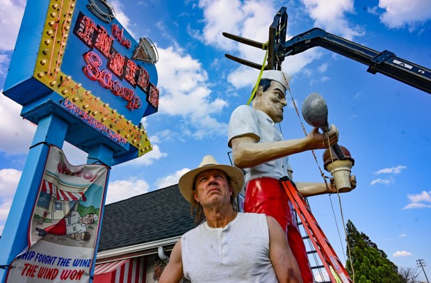 Roadside artist Mark Cline pieces the Giant Chip statue back together Thursday, April 16, 2026, at Inside Scoop in Coopersburg. The popular, 25-foot-high statue was toppled by high winds in February. Cline, who built the statue, was on site Thursday to repair it. (Monica Cabrera / The Morning Call)