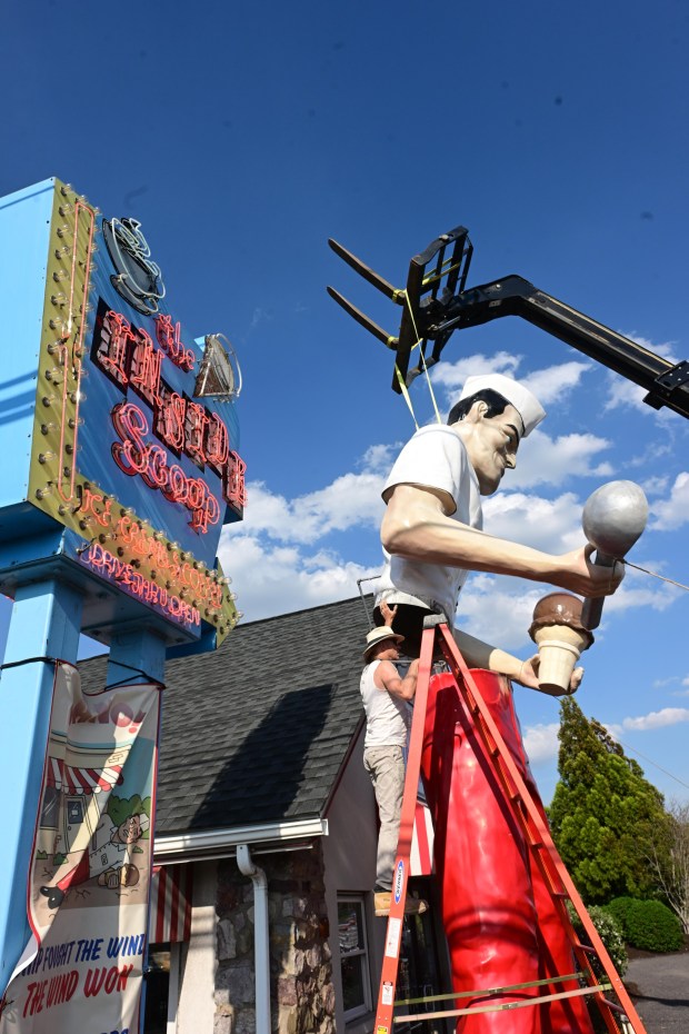 Roadside artist Mark Cline pieces the Giant Chip statue back together Thursday, April 16, 2026, at Inside Scoop in Coopersburg. The popular, 25-foot-high statue was toppled by high winds in February. Cline, who built the statue, was on site Thursday to repair it. (Monica Cabrera / The Morning Call)