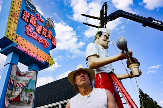 Roadside artist Mark Cline pieces the Giant Chip statue back together Thursday, April 16, 2026, at Inside Scoop in Coopersburg. The popular, 25-foot-high statue was toppled by high winds in February. Cline, who built the statue, was on site Thursday to repair it. (Monica Cabrera / The Morning Call)