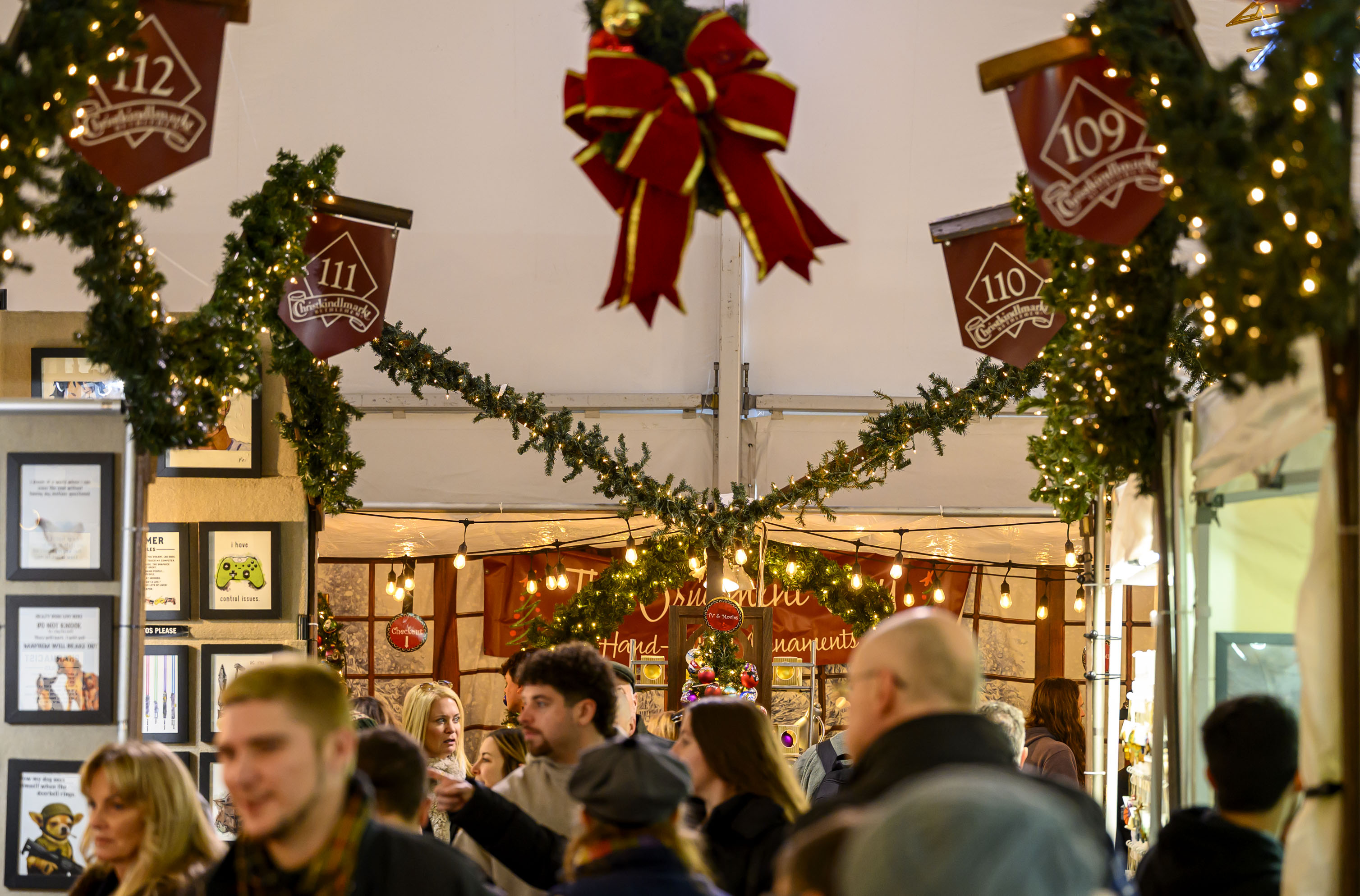 People enjoy the sights and sounds Saturday, Dec. 20, 2025,...