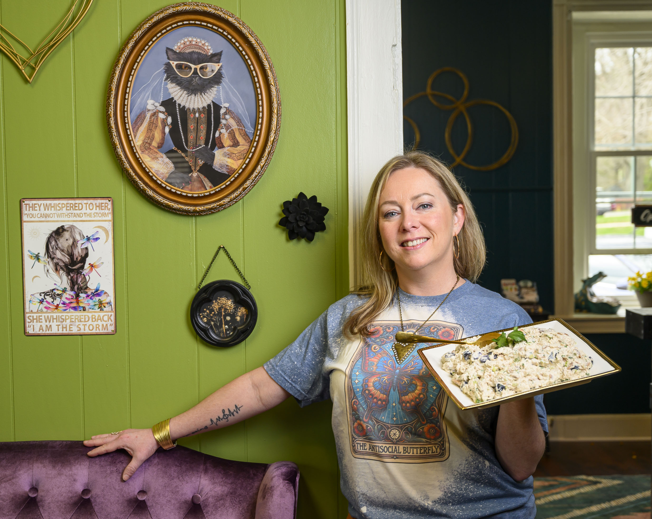 Circle Cafe on Main owner Jennifer O’Neill-Lai holds a dish...