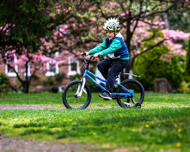 Wearing a long sleeve hoodie, Julian Gieger, 5, of Bethlehem rides his bike with his mother, Janine Pino (not shown), watching nearby Monday, April 20, 2026, during a cool day at the Bethlehem Rose Garden. After temperatures reached into the 80s late last week, they plummeted to below freezing in the Lehigh Valley, with the National Weather Service issuing a freeze warning for overnight Monday into Tuesday. Temperatures are expected return to normal and then be above average by the end of the week. Forecasters said highs will be in the 60s and 70s Wednesday through Friday. (April Gamiz/The Morning Call)