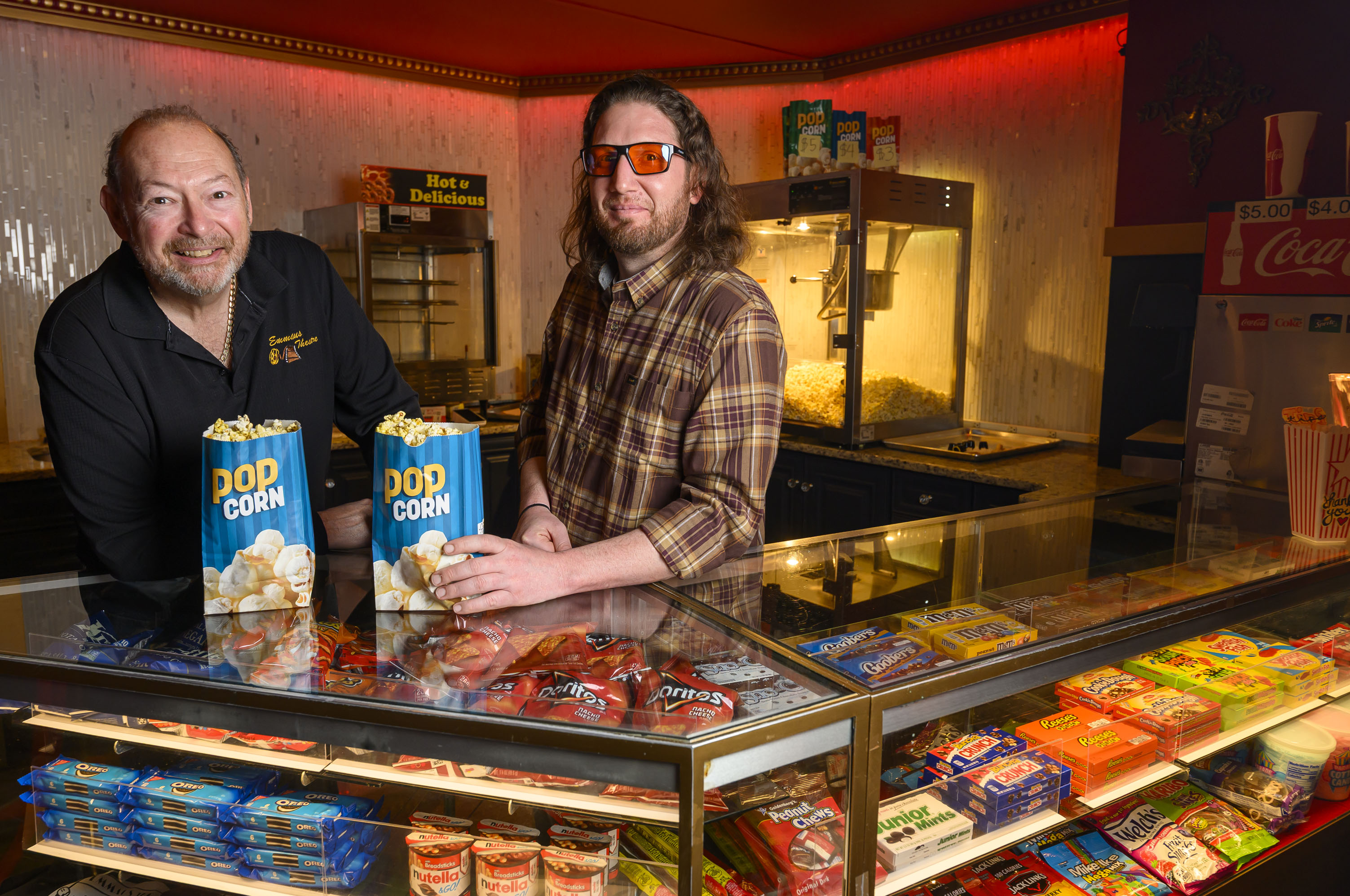 Emmaus Theatre owners Butch Rossetti and Robert Audibert stand behind...