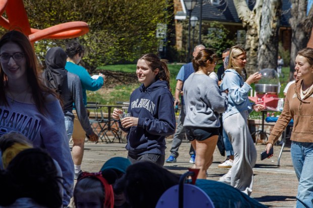 People attend Pawapalooza on Saturday, April 11, 2026, at Moravian University's Priscilla Payne Hurd Academic Complex in Bethlehem. The event supports the Pawprint Project, a student-led organization raising money for the Pediatric Cancer Foundation of the Lehigh Valley. It features live music, games and other activities.(Jane Therese/Special to The Morning Call)
