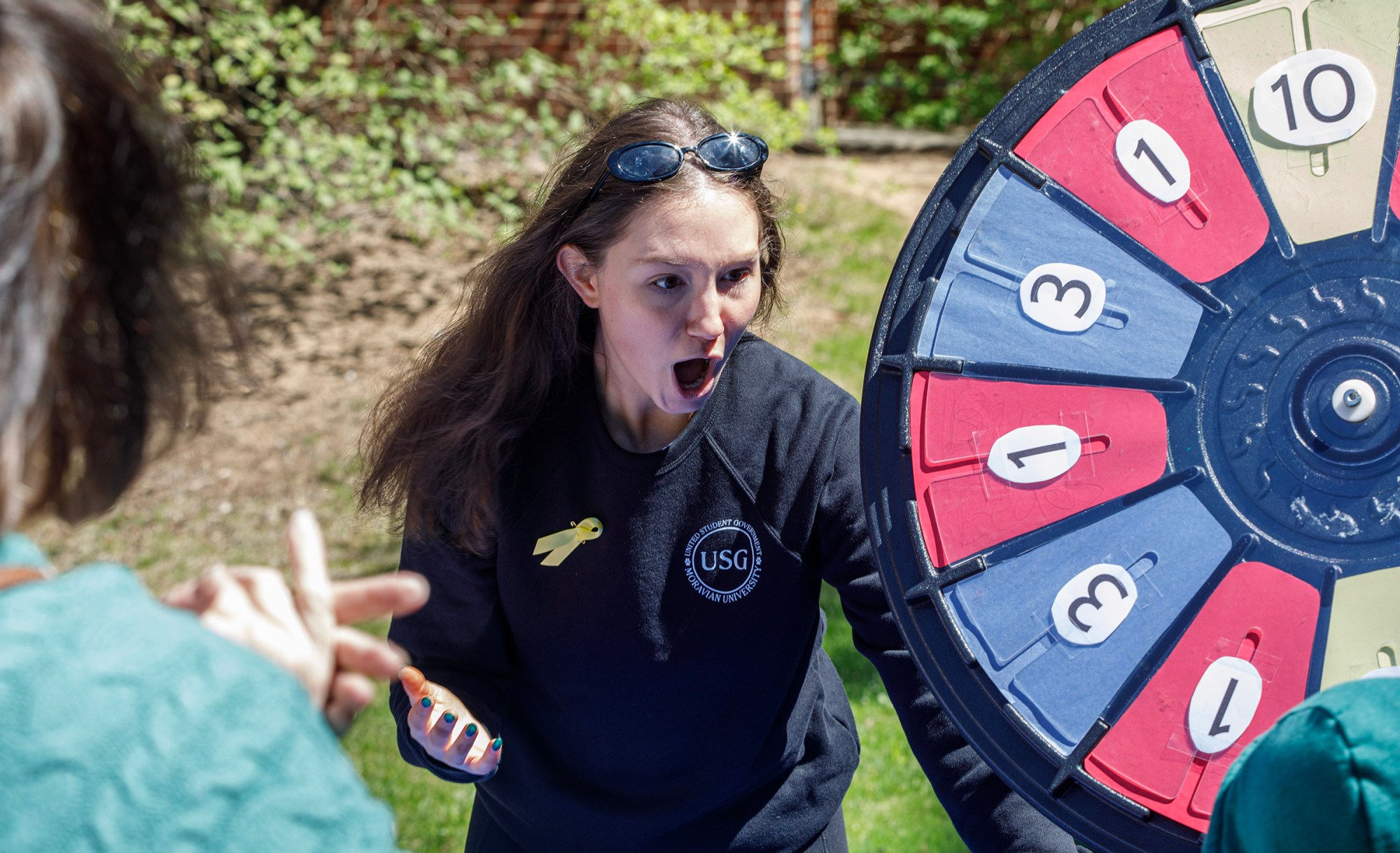 Emily Alonge, a Moravian University junior from East Stroudsburg, reacts to a win during Pawapalooza on Saturday, April 11, 2026, at Moravian University's Priscilla Payne Hurd Academic Complex in Bethlehem. The event supports the Pawprint Project, a student-led organization raising money for the Pediatric Cancer Foundation of the Lehigh Valley. It features live music, games and other activities.(Jane Therese/Special to The Morning Call)