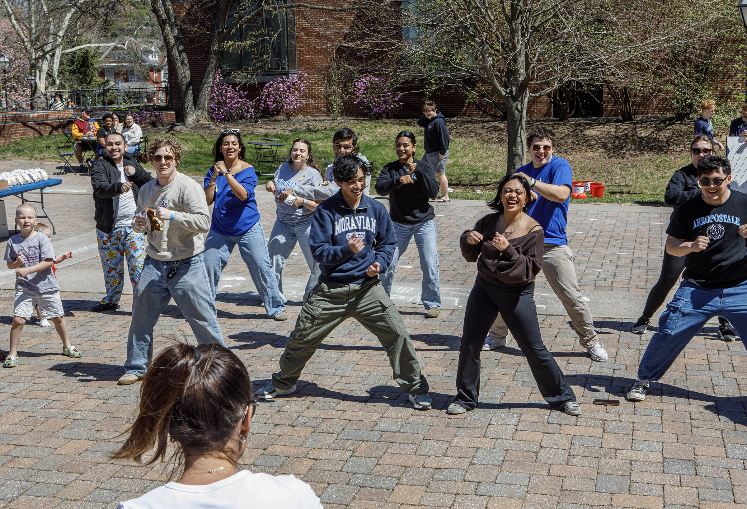 People attend a speed workout led by Rosie Hulbert of Macungie during Pawapalooza on Saturday, April 11, 2026, at Moravian University's Priscilla Payne Hurd Academic Complex in Bethlehem. The event supports the Pawprint Project, a student-led organization raising money for the Pediatric Cancer Foundation of the Lehigh Valley. It features live music, games and other activities.(Jane Therese/Special to The Morning Call)