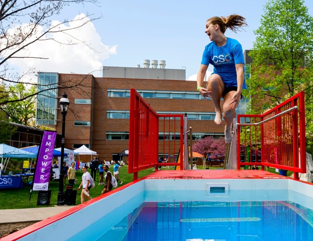 Lehigh University student Alana Reddy jumps into the cold water Friday, April 17, 2026, during Special Olympics Pennsylvania's Mobile Polar Plunge at Lehigh University in Bethlehem. More than 100 Lehigh students and staff jumped into the water to raise money and awareness for athletes with intellectual and developmental disabilities. (April Gamiz/The Morning Call)