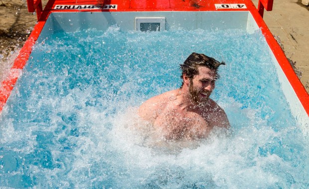 Lehigh University student Jake Stalsitz jumps into cold water Friday, April 17, 2026, during Special Olympics Pennsylvania's Mobile Polar Plunge at Lehigh University in Bethlehem. More than 100 Lehigh students and staff jumped into the water to raise money and awareness for athletes with intellectual and developmental disabilities. (April Gamiz/The Morning Call)